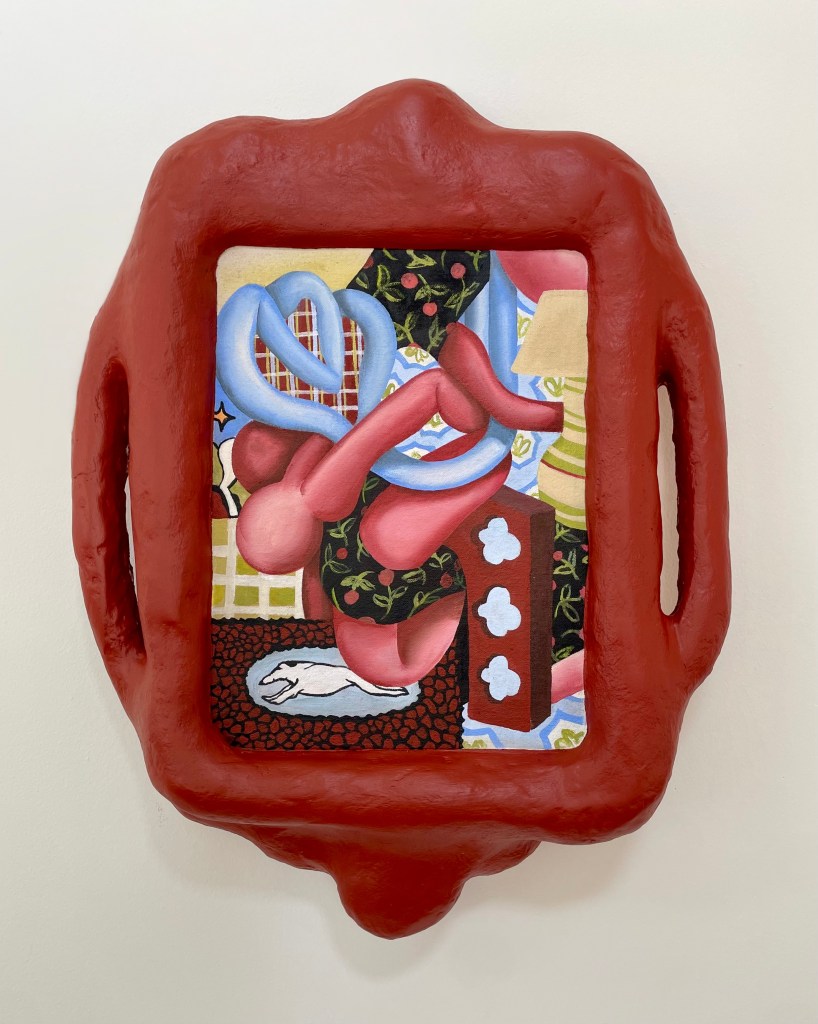 A mixed-media artwork featuring a red, sculptural frame with a colorful, abstract painting inside, showcasing playful shapes and patterns that explore themes of interior spaces.